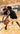 man is holding target while a boy dribbles a basketball