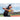 Close-up action shot of female with ball in hand after fielding with SKLZ Fielding Hands trainer at field